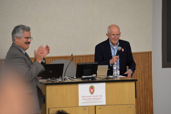 WCER Director Bob Mathieu leads applause for Carpenter during WCER’s 50th anniversary celebration program in 2014.