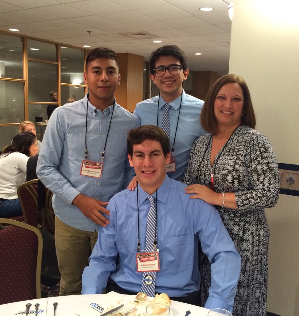 Guery Ulunque (left) and classmates pose with their teacher, Anne Stewart, at the MSAN Institute last year.