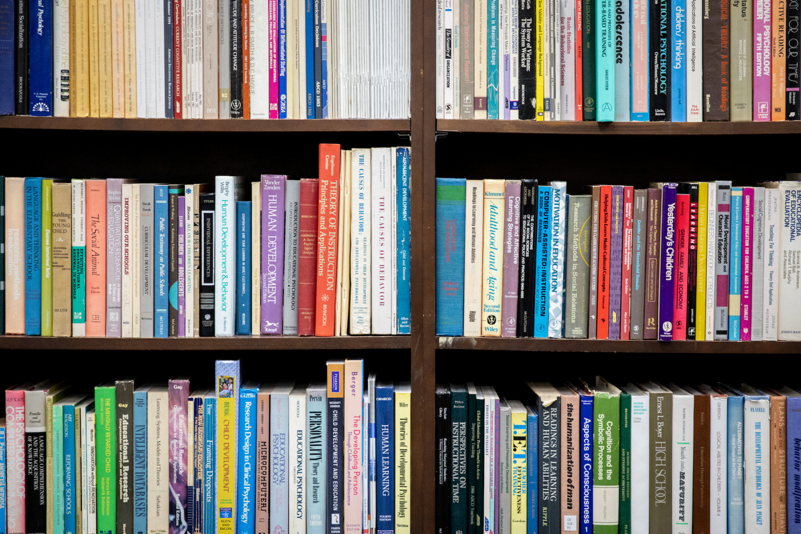 A series of books a lines a bookcase within WCER.